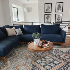 a living room with a blue couch and coffee table