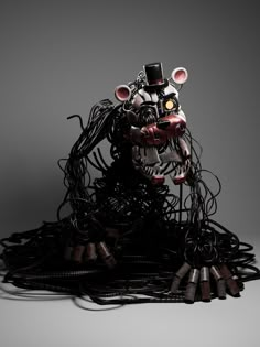 an animal sculpture made out of wires and wire with a top hat on it's head