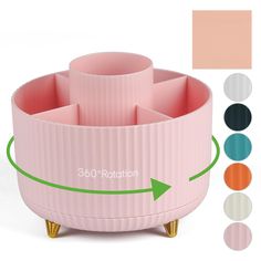 a pink cup holder with three cups on it and four different colors in the background