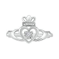 Crafted from sterling silver, the promise of love, loyalty, and friendship is brought to life in this Claddagh ring. Featuring one round brilliant cut diamond, the symbolic meaning is displayed with intricate charm. Promise Jewelry With Single Diamond In Diamond White, Diamond White Jewelry With Single Diamond For Promise, Diamond White Birthstone Jewelry For Promise, Diamond White Jewelry With Birthstone For Promise, White Gold Jewelry With Diamond Accents For Promise, White Birthstone Jewelry For Promise, Sterling Silver Diamond Ring For Promise, Sterling Silver Diamond Ring With Single Diamond, Promise Diamond Ring With Center Stone In Sterling Silver