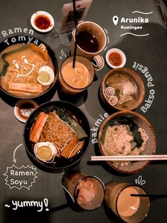 a table topped with bowls of food and chopsticks on top of each other