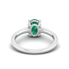 This exquisite ring features a stunning oval emerald stone surrounded by sparkling diamonds, creating a timeless and elegant piece of jewelry. The emerald's rich green color is beautifully complemented by the brilliance of the diamonds, making it a perfect choice for special occasions or as a luxurious everyday accessory. Metal: 14K Gold Setting Type: Prong Rhodium Finish: Yes, on White Gold Gemstone Details: Gemstone: Emerald Shape: Oval Average Dimensions: 8.00 x 6.00 MM Quantity: 01 Average C Emerald And Diamond Ring, Dance Jewelry, Rich Green, Birthstone Gifts, Ring Pendant Necklace, Emerald Stone, Everyday Accessories, Sparkle Diamonds, Mens Wedding Bands