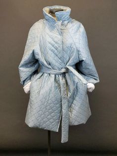 "Blue Quilted coat with soft warm white fleece lining.  This coat is beyond comfort while still looking fashionable.  Great with both casual or dressy outfits.  It is a Woman's size M.  Measures 35.5\" in length from the back color down.  The front is slightly shorter at 32.5\"  Sleeves are 25.5 and fully lined.  They can also be rolled cuffed to show off the white.  At the waist open it measures 58\" in circumference.  It has pockets and a tie closure." Quilted Housecoat, Quilted Blue Hooded Outerwear, Blue Long-sleeve Quilted Jacket For Winter, Blue Functional Moisture-wicking Outerwear, Blue Long Sleeve Parka With Double-lined Hood, White Fleece, Quilted Coat, Blue Quilts, Dressy Outfits