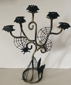 a metal art piece with black and white designs