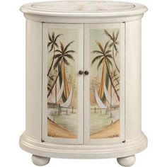 a white cabinet with palm trees and sailboats painted on the doors, sitting in front of a white background