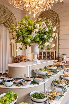 a buffet table filled with lots of food