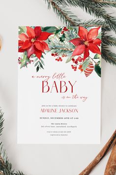 The gender neutral merry little baby shower invite has a white background with watercolor pointsettias & winter everygreens and holly berries with a gold Christmas ornament, paired with the phrase 'a merry little baby is on the way' using elegant serif and script fonts in a christmas red, with the other Christmas theme baby shower details in dark gray to add visual interest to your merry little baby shower invitation. Baby Shower Christmas Theme Girl, Christmas Baby Shower Ideas For A Girl, December Baby Shower Ideas Girl, Girly Baby Shower Themes, December Baby Shower Ideas, Boy Or Girl Baby, December Baby, Neutral Christmas