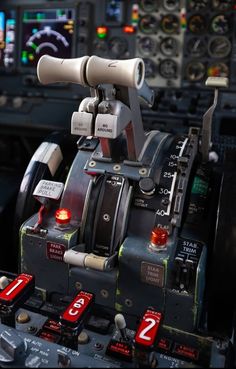 the cockpit of an airplane with many controls