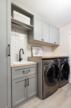 a washer and dryer in a small room