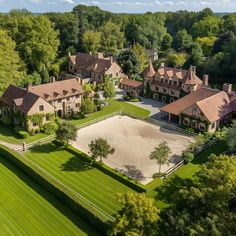 an aerial view of a large estate surrounded by trees