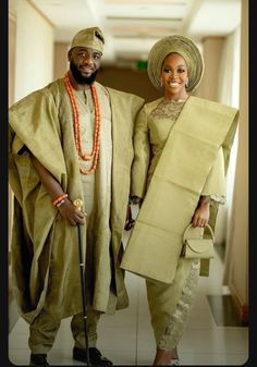 a man and woman dressed in traditional african clothing