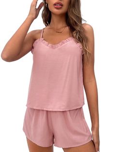 This Trim Lounge Cami Top And Shorts is the ideal choice for those moments when you want to relax and feel comfortable. The set comes with a top and bottom made from knitted fabric that offers medium stretch and a soft feel. The top features a round neckline and sleeveless cut, while the bottoms have an adjustable knot waistband for added comfort. With its casual design, this lounge set will make lounging around even more fun. Features: Style: Casual Pattern Type: Plain Type: Short Sets Color: Pink Material: Woven Fabric Pants & Tops Composition: 100% Viscose Neckline: Spaghetti Strap Number of Pieces: 2 Piece Set Sleeve Length: Sleeveless Fabric: Slight Stretch Sheer: No Color: Pink Size Chart (cm): Top Size Size US Bust Length XS 2 88 50 S 4 92 51 M 6 96 52 L 8/10 102 53.5 Pant Size Size Summer Modal Tank Top For Loungewear, Soft Touch Tops For Spring Loungewear, Stretch Modal Tank Top For Loungewear, Modal Stretch Tank Top For Loungewear, Summer Seamless Pajama Shorts For Loungewear, Summer Modal Sleepwear For Lounging, Casual Seamless Pajama Shorts For Loungewear, Summer Lounging Modal Sleepwear, Stretch Tops For Summer Pajama Party