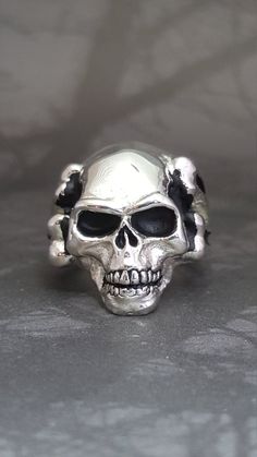 "*RING MAY SLIGHTLY DIFFER FROM PICTURES AS EACH RING IS HANDMADE* .925 Solid Sterling Silver Handmade Bone Skull Ring Made In USA Made in America Each ring is handmade to your size by professional jewelers The weight varies depending on size We have sold many rings around the world and each is custom made through a Lost Wax casting process using a hand cut master pattern Each ring is hand crafted and is stamped on the inside \"STER\" This ring will come with a ring box and will be wrapped in an Many Rings, Sterling Silver Skull Rings, Silver Skull Ring, Lion Ring, Wax Casting, Lost Wax Casting, Snake Ring, Gold Snake, Skull Ring