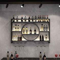 a bar with wine glasses and bottles on it