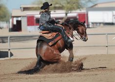 a woman riding on the back of a brown horse