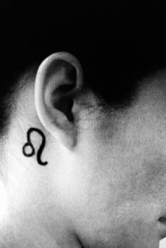 a person with a tattoo on their ear