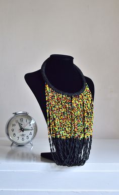 Unique African Maasai Handcrafted Beaded Necklace with an Elegant Look and Brilliant Finish. **GET FREE SHIPPING FOR ADDITIONAL ITEMS PURCHASED. Yes, Buy Multiple Items and pay shipping for 1 item only- The rest ships Free. (No Limits on the number of Multiple items). With a faster delivery time of 3 days via DHLExpress, Worldwide. Ordinary/Standard Shipping also available upon request. We Custom Make to Suit Your Taste. Available In All Colors and Sizes. For wholesale please chat me up for disc Traditional Handwoven Black Necklace, Traditional Black Handwoven Necklace, Bohemian Multicolor Necklace With Black Beads, Handwoven Black Bohemian Beads, Black Bohemian Handwoven Beads, Bohemian Black Handwoven Beads, Yellow Bohemian Necklace With Black Beads, Handwoven Black Beads For Festival, Black Handwoven Beads For Festival