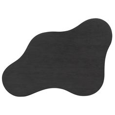 a black piece of wood sitting on top of a white surface with an oval shape