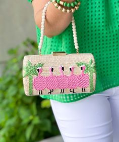 Introducing our "Be A Flamingo Clutch Bag," a delightful accessory that adds a touch of whimsy and elegance to any ensemble. This charming box clutch features a faux straw exterior embellished with an embroidered flamingo motif, perfect for adding a playful pop of color and personality to your look.
Measuring at a width of 8 inches, a height of 4.25 inches, and a depth of 2 inches, this clutch offers enough room to carry your essentials while still remaining compact and stylish. The detachable shoulder chain provides versatility, allowing you to wear it as a shoulder bag or carry it as a clutch, depending on your preference.
Whether you're attending a summer wedding, heading to a tropical vacation, or simply looking to add a touch of fun to your everyday outfits, this clutch is sure to tur Chic Summer Clutch For Fashion, Pink Summer Beach Clutch, Rectangular Pink Clutch For Vacation, Spring Rectangular Clutch, Pink Rectangular Clutch For Vacation, Summer Beige Clutch For Party, Rectangular Clutch For Spring, Summer Party Beige Clutch, Chic Spring Clutch As Gift