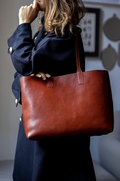 This handmade leather bag is made with 100% natural full grain leather which is tanned with all natural materials. There is no chemical materials in this leather. This bag is handmade in our studio in Milan. The lining is 100% cotton and it is easy to clean. The bag has one middle divider which is a big zipped pocket. There is One smaller zipped pocket in one side All the bags will come with a cotton dust bag which can protect the leather and bag when it is not in use. In options u can find Prot Elegant Leather Backpack For Work, Elegant Everyday Shoulder Bag In Vegetable Tanned Leather, Luxury Vegetable-tanned Tote Shoulder Bag, Elegant Brown Leather Backpack For Everyday, Elegant Textured Vegetable Tanned Leather Bags, Luxury Everyday Vegetable-tanned Bags, Modern Shoulder Bag In Vegetable Tanned Leather, Elegant Leather Backpack With Smooth Grain, Vegetable Tanned Leather Satchel With Leather Lining