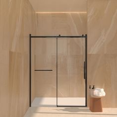 a bathroom with a glass shower door next to a sink