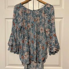 This Is A Beautiful Blouse! Just A Little Long For Melight Blue With Rust Color And Cream Floral Print, Ruffled Bell Sleeves, Pretty Tie In Back Of Neck, Longer In Back (Tunic Length In Back) Very Flowy And Feminine And Silky Soft Rayon. Love The Print Of This Blouse So Much! New With Tags. Light Blue Blouse For Spring Vacation, Light Blue Blouse For Vacation In Spring, Chic Light Blue Floral Print Top, Light Blue Feminine Blouse For Brunch, Feminine Light Blue Blouse For Spring, Flowy Blue Blouse For Day Out, Flowy Blue Blouse For Brunch, Light Blue Floral Print Vacation Tops, Light Blue Floral Print Blouse For Vacation