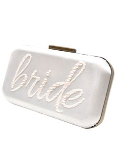 Have your happily EVER AFTER with our top selling bride clutch, which is the perfect accessory for your engagement party, bridal shower and wedding day! Adorned with highest quality, brilliant cut crystals and pearls, this purse will add the perfect touch of sparkle and glamour. This clutch advertises your place on your big day as boldly as your wedding dress does using a gorgeous collection of sparkly crystals or the finest imitation pearls swirling around the center. The crystals spell out the Luxury White Classic Clutch, Satin Backdrop, Bride Clutch, Sparkly Crystals, Classic Pearl Necklace, Sparkly Accessories, Pearl Bride, Sparkly Jewelry, Bridal Clutch