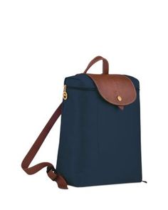 A timeless and durable nod to French style, Longchamp's nylon backpack stows everyday essentials for a tres-chic hands-free commute. Le Pliage Medium, Longchamp Le Pliage Medium, Medium Backpack, Navy Gold, Tres Chic, Everyday Essentials, Longchamp Le Pliage, French Style, Handbag Backpack