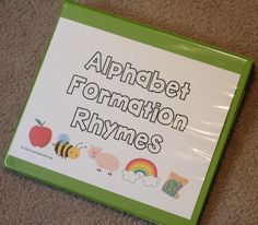 a green and white sign that says alphabet formation rhymes with pictures of animals