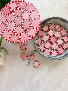 red and white sugar cookies in a tin with flowers