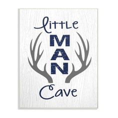 a sign that says little man cave with antlers