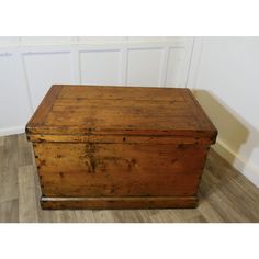 an old wooden box sitting on the floor