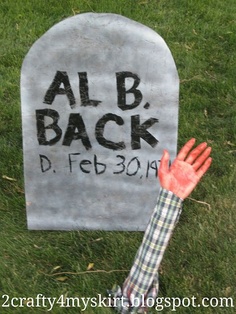 a hand is reaching out from behind a gravestone that reads,'alb back d febson '