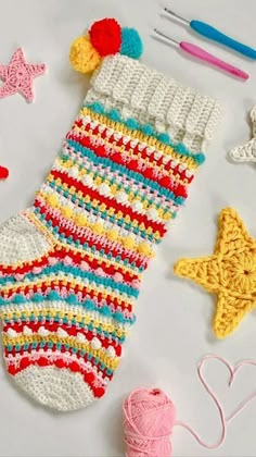 crocheted socks and other items are laid out on the table