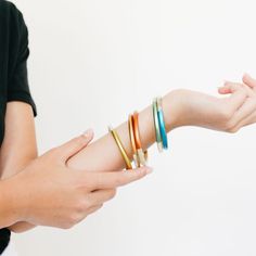 The metallic pop colors on our core bangle set is a fan favorite in the Sunshine Tienda office. The shine on these make them even that more special! Color: Blue, green, yellow, orange and red. Size: Cir-8" - 8.5", Stack- 1.13", Dia- 2.5" - 2.6", Stack of 5 *Need to request a larger size? Please reach out to us at help@sunshinetienda.com* Your bangle is made from all-natural material and as such the horn color may vary slightly from what is shown. While all horn is very similar in appearance, no Modern Multicolor Cuff Bangle Bracelet, Modern Multicolor Bangle Cuff Bracelet, Modern Orange Bangle Bracelets, Bangle Set, Shine On, San Pedro, Natural Material, The Sunshine, Yellow Orange