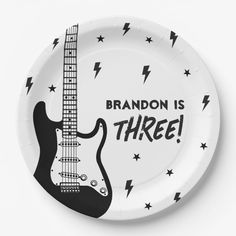 a paper plate with an electric guitar on it