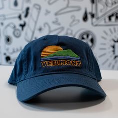 NEW Dad Hat Style Soft unstructured organic cotton, adjustable strap back Our original Vermont sunset design is embroidered right onto the hat in our Vermont studio. Three colors to chose from! New Duds is a screen print shop located in northern Vermont. We were started by a husband and wife team and have grown to a lovely crew that works hard to create clean, detailed screen prints. All blank apparel, fabric and paper is USA made when it can be an printed in our studios. All art is hand drawn a Northern Vermont, Baseball Apparel, Hat Inspiration, Canvas Hat, Sunset Design, 5 Panel Hat, Blank Apparel, Baseball Outfit, Panel Hat