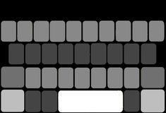 a black and white photo of a computer keyboard with several squares on the back ground