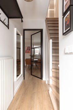 the hallway is clean and ready to be used as a dining room or living room