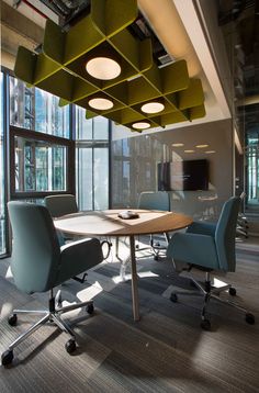 an office meeting room with chairs and a table