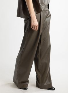 This style features: Mid-rise waist Wide leg Pleated trouser Front pockets Fly front with zipper and two buttons Fabric content: 100% PU outer Dry clean or hand wash only Designed by Meg in Brooklyn, NY. Made in the USA. High-waisted Leather Pants With Pockets For Work, Leather Workwear Bottoms With Pockets, Fall Pants With Zip Fly, Fall Trousers With Zip Fly, High-waisted Leather Pants For Business Casual With Belt Loops, Business Casual High-waisted Leather Pants With Belt Loops, Business Casual High-waisted Leather Pants, High-waisted Leather Pants With Pockets, Fall Workwear Leather Pants With Zip Fly