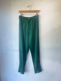 Electric Feathers Green Raw Silk Noil Trousers. Size Small. Button fixtures at bottom. Approximate measurements:Waist: 14"Inseam: 29" Electric Feathers, Silk Noil, Raw Silk, Feathers, Electricity, Trousers, Silk, Green