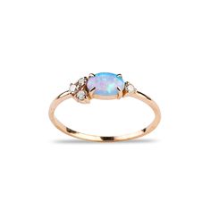 an opal and diamond ring in yellow gold