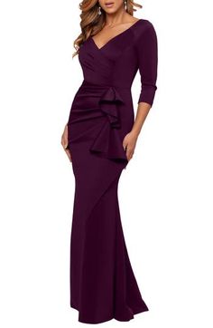 A ruched bodice and cascading side ruffles lend dramatic elements to a scene-stealing scuba gown that will captivate your party guests. 95% polyester, 5% spandex Dry clean Made in the USA of imported fabric