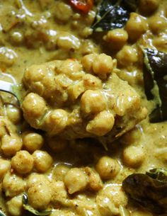 a close up of food in a bowl with a spoon