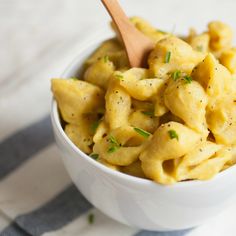 a white bowl filled with macaroni and cheese