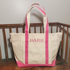 "Monogrammed Medium Tote, Personalized Canvas Tote Bag, Personalized Pet Bag, Monogram Grandma Tote, Baby Diaper Bag Great Bridesmaid Gift, Baby Gift, Host/Hostess Gift! FREE SHIPPING! Choose a Monogram, Name or make it your own with any wording you like. You are not limited to the fonts shown. Message me for more options! 12\" H x 18\" W x 5.5\" D 1.85 lbs 18 oz Canvas Top zip closure Self constructed canvas handle in contrasting trim color Spacious interior with flat bottom I keep a few colors in stock but they are available with straps in the following colors. I can usually have them in a week and ship within another week. Send me a message for more information. Red               Orange          Coral Pink  Black            Hot Pink         Maroon Natural         Emerald         Turquoi Rectangular Everyday Shoulder Bag With Embroidered Logo, Rectangular Shoulder Bag With Embroidered Logo For Everyday, Rectangular Shoulder Bag With Embroidered Logo, Pink Bags With Embroidered Logo For Daily Use, Rectangular Canvas Bag With Embroidered Logo For Travel, Rectangular Travel Canvas Bag With Embroidered Logo, Everyday Rectangular Bags With Embroidered Logo, Personalized Pink Bag For Everyday, Personalized Pink Bags For Everyday