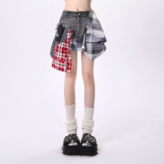 The Rayohopp Edgy Grunge Outfit Set is a women's ensemble featuring an asymmetrical patchwork skirt and a cropped 'Angster Club' graphic tee. This set combines a rebellious, grunge-inspired aesthetic with contemporary fashion elements. The skirt showcases a unique patchwork design, while the cropped tee adds an edgy statement with its bold graphic. Model's measurements: Height 160cm, Weight 45kg, Wearing size S Casual Asymmetrical Skirt With Patchwork, Trendy Mini Skirt With Patchwork, Edgy Fitted Patchwork Bottoms, Casual Patchwork Skirt With Asymmetrical Hem, Casual Skirt With Patchwork And Asymmetrical Hem, Casual Skirt With Asymmetrical Hem And Patchwork, Cotton Patchwork Asymmetrical Skirt, Edgy Grunge Outfits, Edgy Grunge