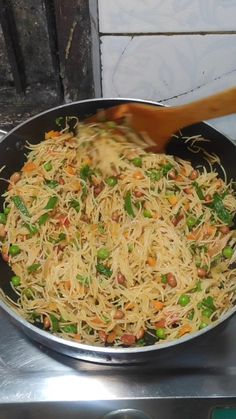 a pan filled with food on top of a stove