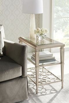 a living room scene with focus on the end table and chair next to the couch